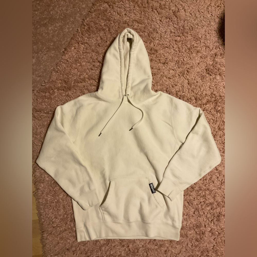 Hello! I am selling a sweater with a hood and a front pocket.
